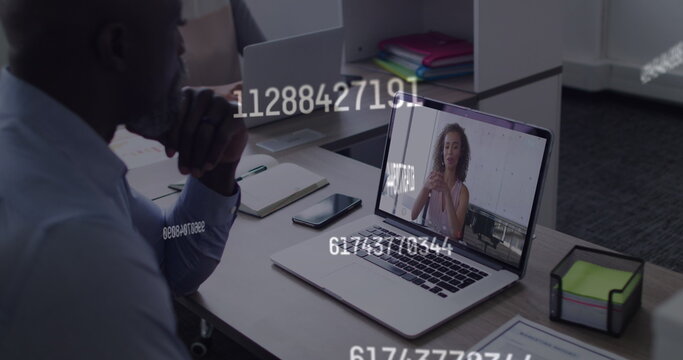 Image of numbers processing over businessman using phone headset - Powered by Adobe