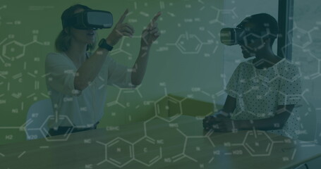 Image of chemical formulas over diverse women in vr headset