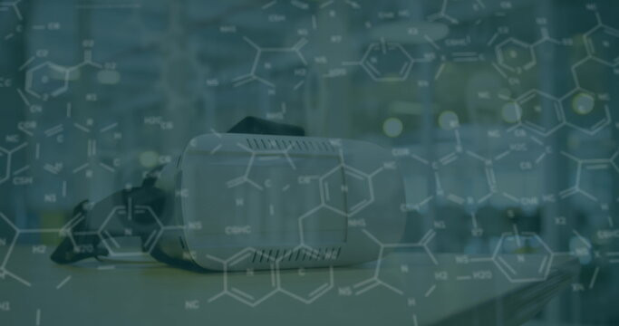 Image of chemical formulas over vr headset