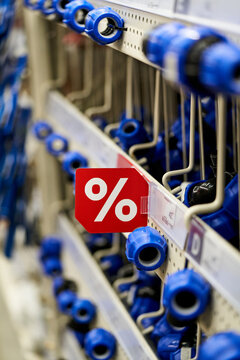 Discount signage in a home improvement store aisle