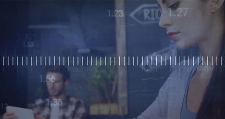 Image of technology icons over caucasian woman using laptop