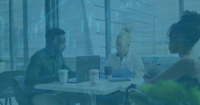 Image of financial data and graphs over diverse coworkers in office