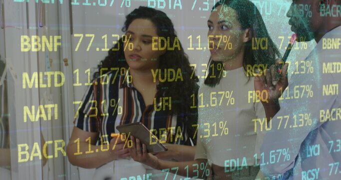 Image of financial data and graphs over diverse businesspeople in office