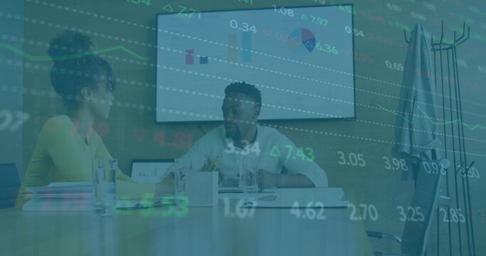 Image of financial data over diverse coworkers in office - Powered by Adobe