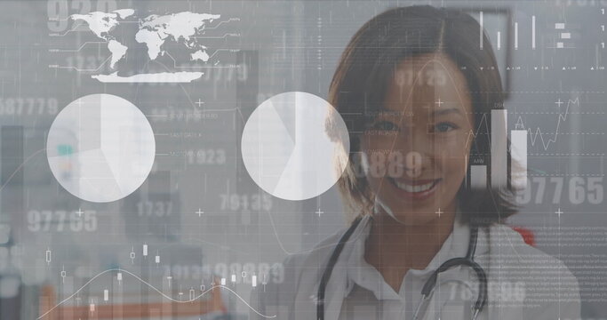 Image of interface screen with charts and data over portrait of smiling asian female doctor - Powered by Adobe