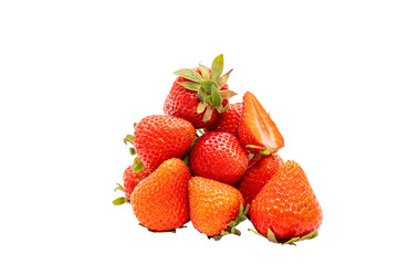 A pile of fresh strawberries, partially sliced, presented on a white background. An image full of summer freshness and natural sweetness.