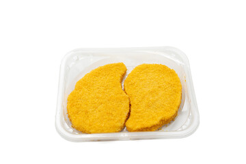 Two breaded schnitzels in a plastic tray, isolated on white background. Ready for frying or baking.