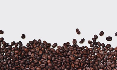 coffee beans on white background. Coffee beans background with copy space for text. Roasted arabica coffee texture