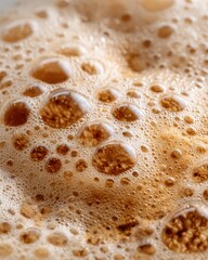 Coffee break cozy vibe. Close-Up of Coffee Foam with Bubble Texture on Natural Background, Capturing Artistic Details and Warmth