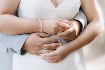 Newly wed couple's hands with wedding rings. Exchange of wedding rings