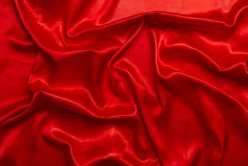 The bright red satin fabric is beautifully wavy, luxurious and elegant.