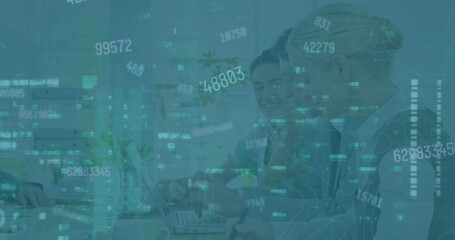 Image of financial data and graphs over diverse female coworkers in office