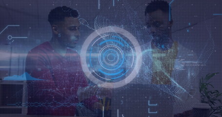 Professionals collaborating around laptop in modern office, with holographic data visualization