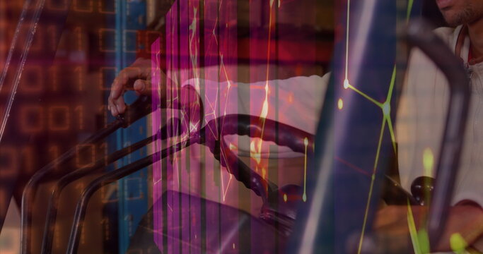 Image of graphs and connections over hands of male warehouse worker - Powered by Adobe