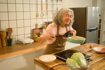 Elderly Woman Cooking with Passion and Emotion