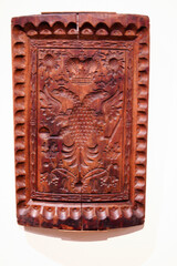 wood carving on the white background, closeup of photo with selective focus