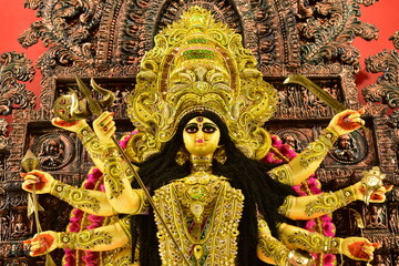 Beautifully adorned Durga Maa idol with multiple arms.