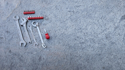 Professional work tools on concrete, prepared for maintenance and repair tasks. Copy space