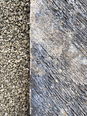 Rough surface texture of concrete and grey gravel