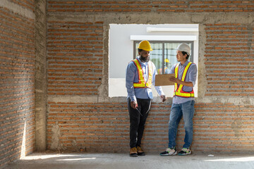 Construction workers collaborating on a building project at a construction site in the daytime