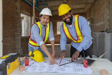 Construction workers collaborating on a building project at a construction site in the daytime