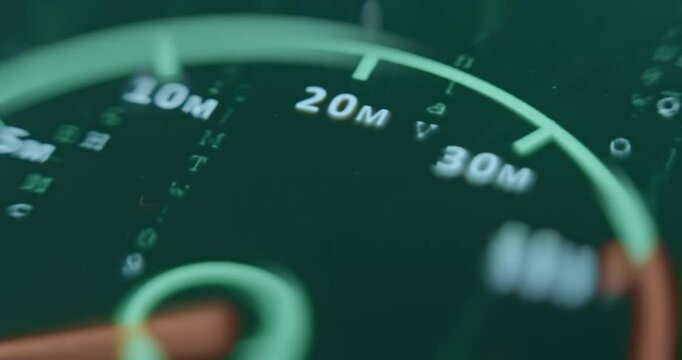 Speedometer with green code rain background