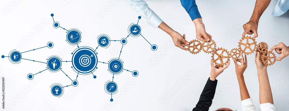 Aufkleber This image captures a diverse group collaboratively holding gears, symbolizing teamwork and innovative strategies to achieve business goals in a modern workspace. Amity