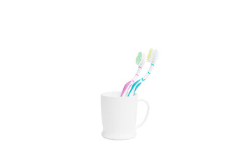Two colorful toothbrushes in a plain white plastic mug with transparent background. Ideal for dental care ads, hygiene product promotions, or e-commerce listings for bathroom essentials.