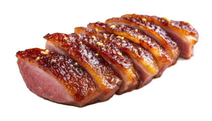 Close-up of perfectly seared and sliced duck breast on a sleek black background