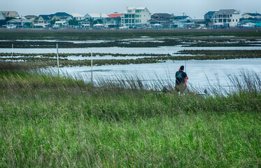Fisherman in the Marsh