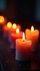 Close-up of several flickering candle flames, casting a warm, inviting glow Perfect for romantic, relaxing, or spiritual themes Soft focus highlights the dancing light , luxury, spa
