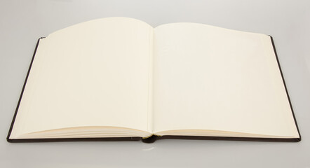 Open book showing blank pages on white background