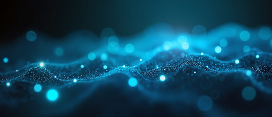 An abstract digital image showing densely clustered, glowing blue particles in smooth, dynamic wave patterns, creating a futuristic, energetic effect on a dark gradient background.