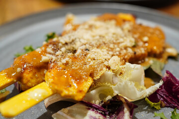 Sate Gai (Grilled and marinated chicken skewers served with Thai peanuts dipping sauce) from authentic Thai restaurant