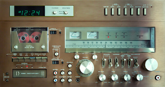 Vintage Audio Stereo Gear Setup Copper Front Panel with Multiple Controls Including Display, Knobs, Buttons, Keys, Switches.