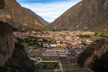 Ollantaytambo Village Modern Buildings Residential Area as seen from the Fortress Wall amid Andes Sacred Valley Mountains, Peru