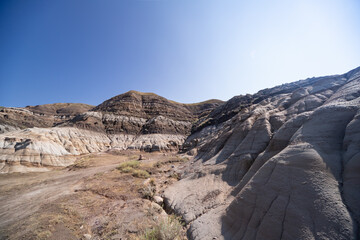 Surreal Badlands Sandstone Formations near Drumheller, Land of hoodoos, multi-hued canyons and geological erosion sculptured by water and wind