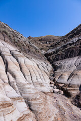 Surreal Badlands Sandstone Formations near Drumheller, Land of hoodoos, multi-hued canyons and geological erosion sculptured by water and wind