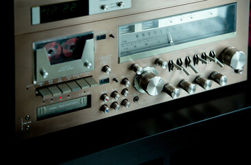 Vintage Audio Stereo Gear Setup Copper Front Panel with Multiple Controls Including Display, Knobs, Buttons, Keys, Switches
