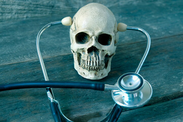 Weathered human skull and stethoscope,Medical concept.