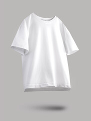 White loose t-shirt isolated on grey background with shadow flying. Empty logo space, advertisement...