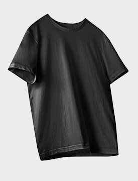 Black cotton t-shirt flying isolated on white, nobody. Regular male tshirt front side. Casual clothes.