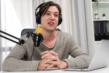 Host channel in smiling smart broadcaster recording, talking show with script and smartphone on...