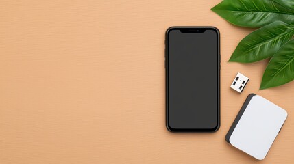Modern smartphone on minimalistic background with USB drive and green leaves showcasing tech and nature harmony