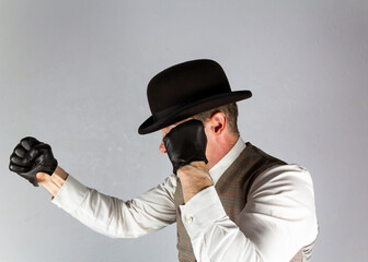 Vintage Ruffian or Back Alley Brawler in Bowler Hat and Leather Gloves With Fists Raised Ready to Fight
