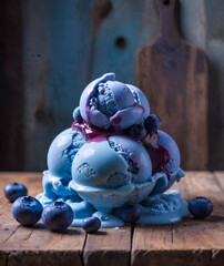 Melting Blueberry Ice Cream Scoops with Fresh Berries