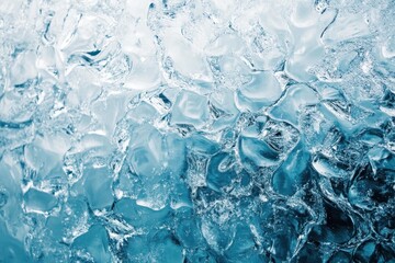 Obraz premium Close-up view of ice cubes filling a glass with clear water in bright light, showcasing textures and reflections in a cool setting