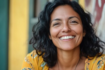 Happy smiling middle-aged woman, Happy middle-aged woman smiling warmly at the camera, exuding joy and positivity