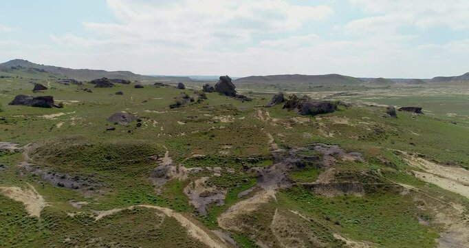 Uninhabited area surrounded by rocks and boulders. Drone shoot of Gobustan, Azerbaijan