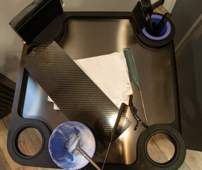 Top view of a professional hairdresser's workstation with hair colouring tools.